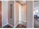 Neutral hallway leading to a brightly lit living area with hard wood floors and light-colored walls at 3261 S Sunland Dr, Chandler, AZ 85248