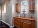 Hallway features a custom cabinet with storage, natural light, and stylish decor at 3261 S Sunland Dr, Chandler, AZ 85248