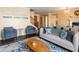 Stylish living room featuring comfortable seating, a fireplace, and tasteful decor, creating a cozy and inviting space at 3261 S Sunland Dr, Chandler, AZ 85248
