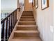Carpeted staircase with dark wood railing, leading to the upper level of the home at 3261 S Sunland Dr, Chandler, AZ 85248