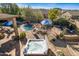 Outdoor living at its finest with a pool, spa, patio, lounge seating, and mountain views at 3830 N Red Sky Cir, Mesa, AZ 85207