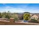 Backyard view featuring neighborhood scenery, mountain vistas, and desert landscaping at 3830 N Red Sky Cir, Mesa, AZ 85207