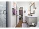 Stylish bathroom with a gray vanity, framed mirror, and an open view to the bedroom at 3830 N Red Sky Cir, Mesa, AZ 85207