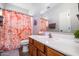 Bathroom featuring vanity, framed mirror, and shower with a decorative floral curtain at 3830 N Red Sky Cir, Mesa, AZ 85207