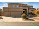 Stunning two-story home featuring a three-car garage and beautifully landscaped front yard at 3830 N Red Sky Cir, Mesa, AZ 85207