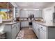 Bright and modern kitchen with stainless steel appliances and gray cabinets at 3830 N Red Sky Cir, Mesa, AZ 85207