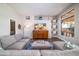 Bright living room featuring a gray sectional, a large window and a media center at 3830 N Red Sky Cir, Mesa, AZ 85207