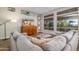 Inviting living room featuring a comfortable gray sectional and a large picture window at 3830 N Red Sky Cir, Mesa, AZ 85207