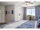 Comfortable main bedroom with scenic views, with a private balcony and arched doorways at 3830 N Red Sky Cir, Mesa, AZ 85207