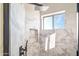 Modern bathroom featuring tiled shower with rainfall showerhead and built-in niche at 3830 N Red Sky Cir, Mesa, AZ 85207