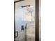 Contemporary shower with marble tile, a rainfall showerhead, and a handheld sprayer at 3830 N Red Sky Cir, Mesa, AZ 85207