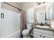 Bathroom featuring tile flooring, shower with curtain, vanity and mirror illuminated by natural light from the window at 4030 E Prickly Pear Trl, Phoenix, AZ 85050