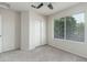 Bedroom featuring a closet with sliding doors and a window that allows ample natural light into the room at 4030 E Prickly Pear Trl, Phoenix, AZ 85050
