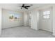 Spacious bedroom featuring neutral carpet, recessed lighting, and three windows offering pleasant natural light at 4030 E Prickly Pear Trl, Phoenix, AZ 85050
