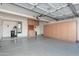 Spacious garage with epoxy flooring, abundant storage cabinets, and a water heater at 4030 E Prickly Pear Trl, Phoenix, AZ 85050