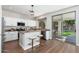 Modern kitchen featuring stone countertops, an island, and stainless steel appliances at 4030 E Prickly Pear Trl, Phoenix, AZ 85050