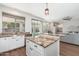 Open kitchen has granite countertops and a view of the backyard pool at 4030 E Prickly Pear Trl, Phoenix, AZ 85050