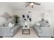 Bright living room with modern decor, ceiling fan and comfortable seating at 4030 E Prickly Pear Trl, Phoenix, AZ 85050