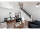 Spacious living area showcasing an open layout and staircase and hardwood floors at 4030 E Prickly Pear Trl, Phoenix, AZ 85050