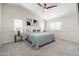 Large main bedroom boasts high ceilings, a ceiling fan, and natural light at 4030 E Prickly Pear Trl, Phoenix, AZ 85050
