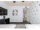 This bedroom includes a TV and themed wall art at 4556 E Paradise Ln, Phoenix, AZ 85032