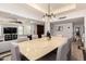 Elegant dining room with stylish lighting, a large table, and easy access to the living area and kitchen at 4556 E Paradise Ln, Phoenix, AZ 85032