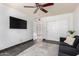 Living room features a large TV and open doorway at 4556 E Paradise Ln, Phoenix, AZ 85032