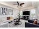 Cozy living room with recessed lighting, modern decor, and large windows at 4556 E Paradise Ln, Phoenix, AZ 85032