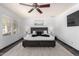 Calm main bedroom features a ceiling fan, neutral colors, and an area rug, creating a comfortable retreat at 4556 E Paradise Ln, Phoenix, AZ 85032
