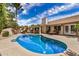 Sparkling pool with a covered patio and outdoor seating area at 4556 E Paradise Ln, Phoenix, AZ 85032
