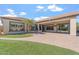 Lovely backyard view featuring a covered patio, desert landscaping, and a sparkling pool at 4589 N 154Th Ave, Goodyear, AZ 85395