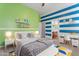 Inviting bedroom decorated with colorful accents, a cozy bed, and a desk area at 4589 N 154Th Ave, Goodyear, AZ 85395