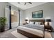 Comfortable bedroom featuring a king bed, stylish decor, and serene natural light at 4589 N 154Th Ave, Goodyear, AZ 85395