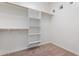 Walk-in closet with built-in shelving and ample storage space at 4589 N 154Th Ave, Goodyear, AZ 85395
