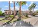 Gorgeous front exterior showing lush desert landscaping including mature palms and multiple cacti at 4589 N 154Th Ave, Goodyear, AZ 85395