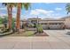 Beautiful desert home with a three-car garage, stone accents, and a meticulously landscaped front yard at 4589 N 154Th Ave, Goodyear, AZ 85395