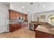 Open kitchen showcases custom cabinetry, stainless steel appliances, and stylish tile flooring at 4589 N 154Th Ave, Goodyear, AZ 85395