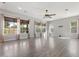 Bright living room with large windows and hardwood floors at 4589 N 154Th Ave, Goodyear, AZ 85395