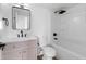 Modern bathroom featuring a sleek vanity, elegant mirror, and a clean, well-maintained shower-tub combo at 4629 E Southern Ave, Phoenix, AZ 85042