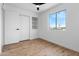 This bright bedroom has hardwood floors, storage shelves and a large window offering ample natural light at 4629 E Southern Ave, Phoenix, AZ 85042