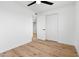 Bright bedroom with wood-look flooring, a ceiling fan, and a closet, offering ample space at 4629 E Southern Ave, Phoenix, AZ 85042