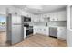 Modern kitchen features stainless steel appliances, stylish cabinets, and neutral countertops at 4629 E Southern Ave, Phoenix, AZ 85042
