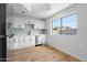 Bright, clean kitchen with modern cabinets, stainless steel appliances, and a large window at 4629 E Southern Ave, Phoenix, AZ 85042
