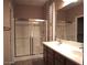 Bathroom featuring a dual sink vanity, large mirror and tub/shower combo at 4747 E Narrowleaf Dr, Gilbert, AZ 85298