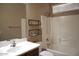 Well lit bathroom with modern sink and shower/tub combo at 4747 E Narrowleaf Dr, Gilbert, AZ 85298