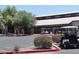 Exterior view of the community clubhouse with golf carts parked, enhancing the community's appeal and activities at 4747 E Narrowleaf Dr, Gilbert, AZ 85298