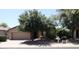 Charming single-story home with a two-car garage and mature trees at 4747 E Narrowleaf Dr, Gilbert, AZ 85298