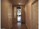 Hallway with wood-look floors leading to the front door at 4747 E Narrowleaf Dr, Gilbert, AZ 85298