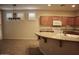 Bright kitchen with a granite island, stainless appliances, and plenty of natural light at 4747 E Narrowleaf Dr, Gilbert, AZ 85298