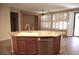 Kitchen with island featuring granite countertops, stainless dishwasher, and ample light at 4747 E Narrowleaf Dr, Gilbert, AZ 85298